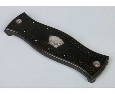 An Edwardian carved and ebonized cribbage board with silver mounts. Assayed London 1907, 27.25cm.   Condition Report. To be u
