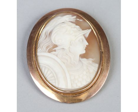 A Victorian carved shell cameo brooch in yellow metal mount. Ovoid in form and decorated with the profile portrait of a Valky