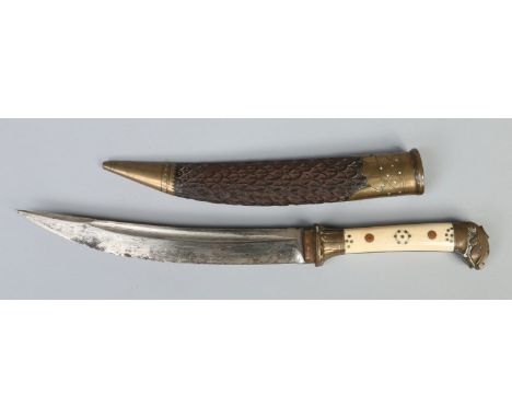 An Indian dagger with piquet inlaid ivory scales and having brass mounted scabbard. Blade length 21cm.   Condition Report. To