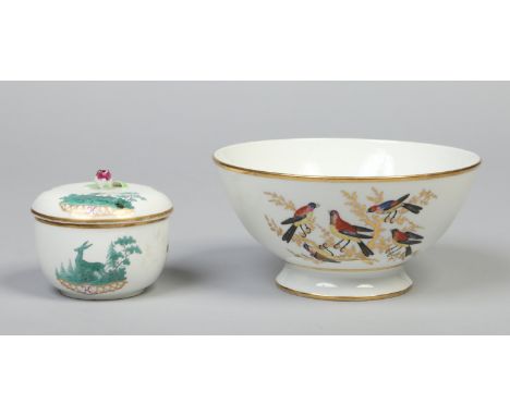 An early 19th century Paris porcelain bowl enamelled with birds perched on gilt branches and an 18th century German sucrier a