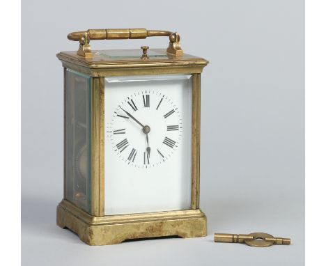 A French brass cased carriage clock with bevelled glass and enamel dial, Roman numeral markers, repeater mechanism and striki