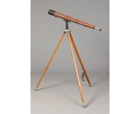 A leather mounted military telescope on tripod stand. Makers W. Ottway & Co. Ltd, Ealing, London. 97cm long in the closed pos