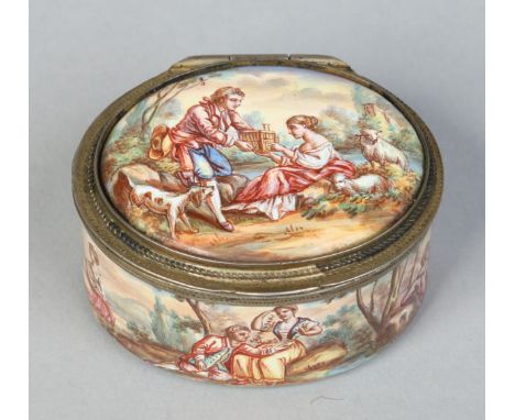 An early 19th century Continental enamel oval snuff box with hinged cover. Decorated with Watteauesque scenes, a romantic lan