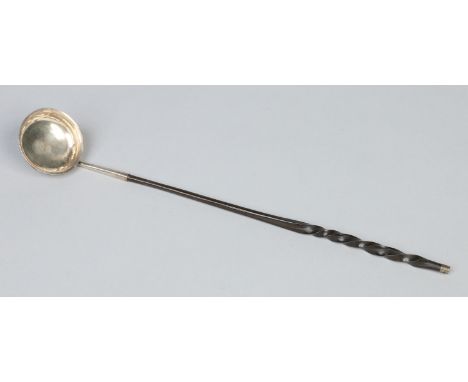 An early 19th century toddy ladle with whale bone handle, 40cm.   Condition Report. To be used as a guide only.  Some slight 