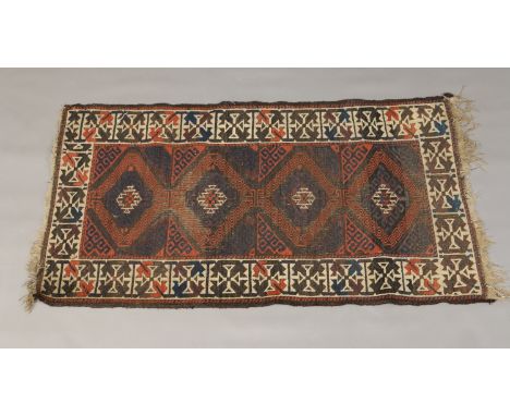 An Eastern hand knotted wool carpet, 153cm x 84cm.