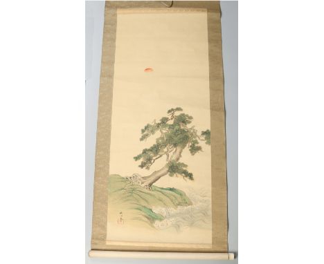 An early 20th century Chinese scroll, painted in watercolour with a gnarled pine tree within a coastal scene. Painted and pri