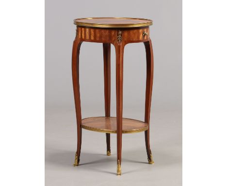 A 19th century kingwood two tier single drawer oval occasional table with gilt metal mounts, 69cm.   Condition Report. To be 