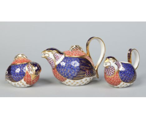 A Royal Crown Derby three part tea service, each component modelled in the form of a quail and decorated in the Imari palette