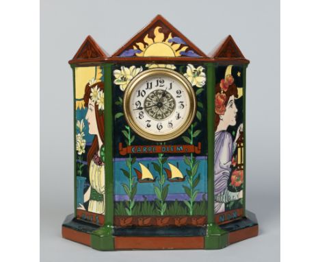 An Art Nouveau Foley Intarsio pottery mantel clock of architectural form designed by Frederick Rhead. Decorated with a pair o