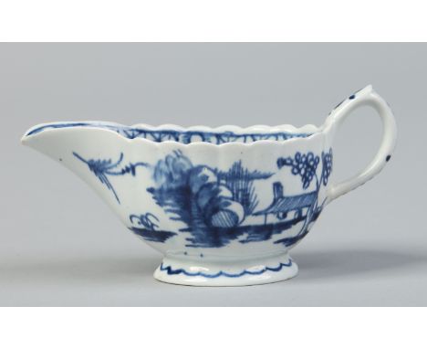 A Bow fluted cream boat painted in underglaze blue with the desirable residence landscape, c1760, 12cm.   Condition Report. T