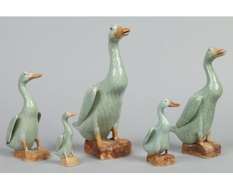 Five 20th century Chinese graduated models of geese. Decorated in celadon glazes and with impressed seal marks. Largest 30cm.