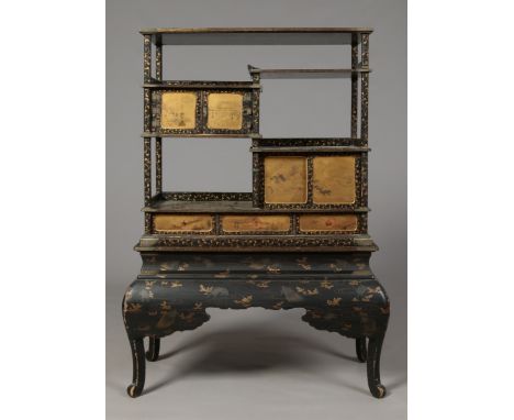 A Japanese early Meiji period lacquered shodana cabinet. Decorated with scrolling foliage and butterflies, the doors with gil