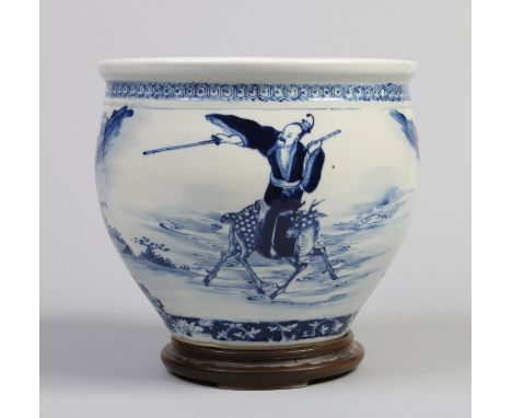 A late 19th / early 20th century Chinese jardiniere on hardwood plinth. Painted in dark underglaze blue with a continuing lan