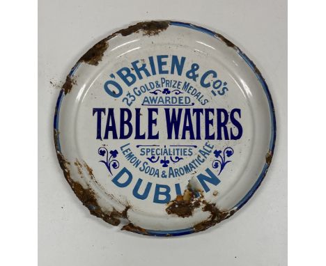 Advertisement: A circular white ground enamel and tin Sign for "O'Brien &amp; Co's Table Waters, Dublin - 23 Gold &amp; Prize