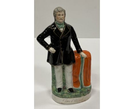 [O'Connell (Daniel)] A large Victorian period Staffordshire Figure of Daniel O'Connell, with black and gilt long coat, standi