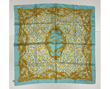 An attractive silk "Christian Dior" Scarf, with medallion centre with lettering "C.D." surrounding by trellis work interwoven