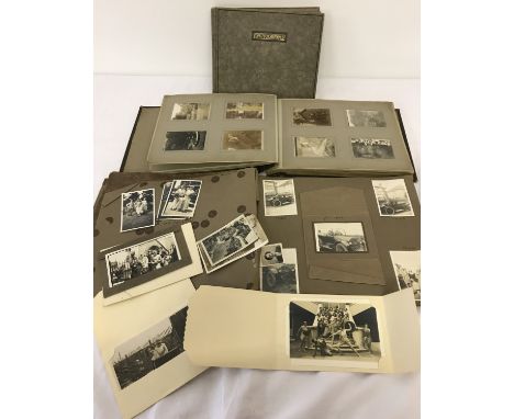 3 vintage photo albums containing 1920's and 1930's family photographs.  Photos include family gatherings, vintage vehicles, 