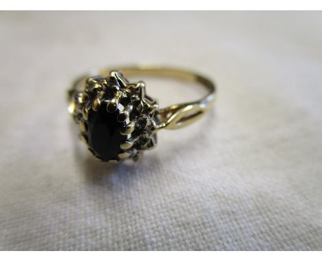 Gold sapphire and diamond cluster ring