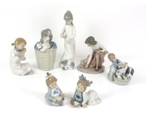 Collection of Lladro and Nao figurines, to include a Lladro dog in a basket, a Lladro figurine of a girl washing a dog, a Nao