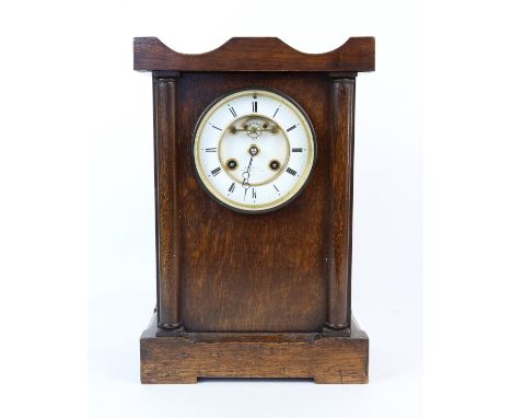 Oak cased mantel clock, the two train movement striking on a bell, the white enamel dial with visible Brocot escapement signe