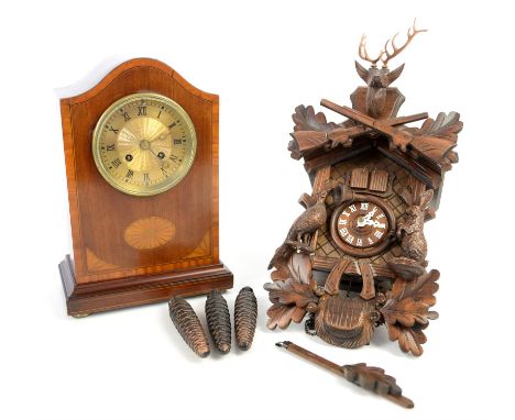 Early 20th century mahogany and marquetry inlaid twin train mantel clock on squashed brass bun feet, and a 20th century cucko