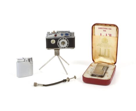 Cased Dunhill lighter, a roman lighter and a novelty combination lighter by KKW in the form of a camera with built in compass