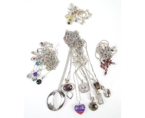 Collection of silver jewellery, mostly pendants and chains all in silver, with a set of earrings, ring and pendant all set wi