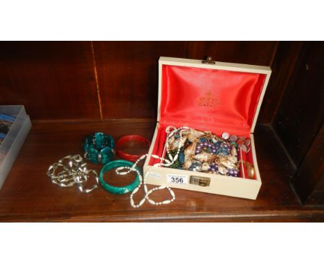 A box of costume jewellery.