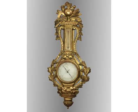 A large gilded barometer/thermometer. Jesso includes repairs