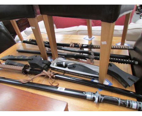 5 decorative Samurai swords and a dagger.