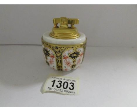 A Royal Crown Derby cigarette lighter.