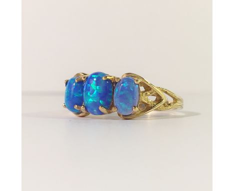 A 3 stone yellow gold opal ring, size M.