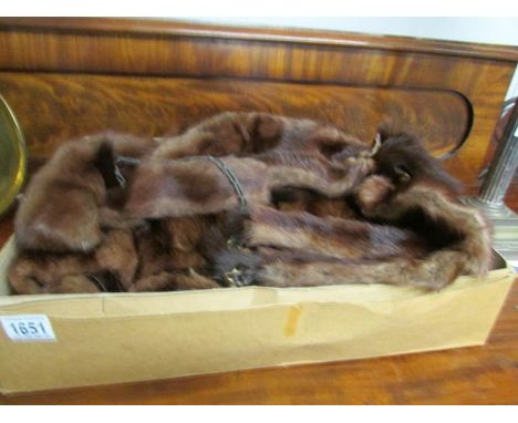 A fur coat and a fur stole.