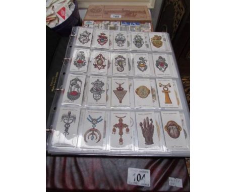 An album of cigarette cards including Will's and John Player including Lucky Charms, Moden Naval Craft, Cries of London, Army