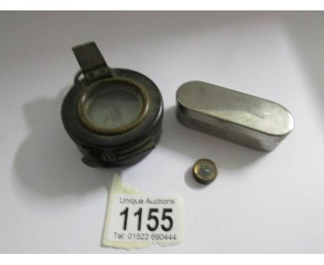 An old brass compass and a smaller example.
