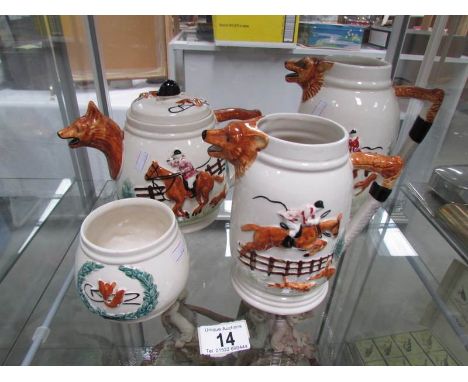 A teapot, 2 jugs and a sugar bowl all with hunting scenes.