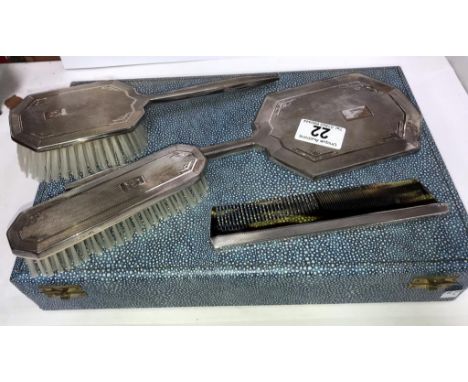 A cased silver backed vanity set comprising brushes, comb etc with Birmingham hall mark.