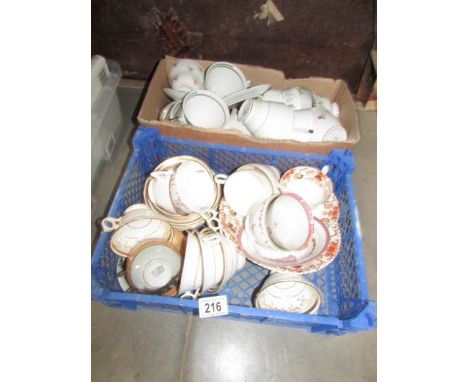 2 boxes of old teacups and saucers.