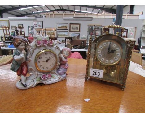 An Anniversary clock (feather damaged) and a ceramic figural clock.