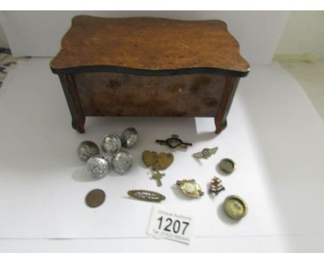 A walnut veneered musical jewellery box and contents including Walsall buttons, Mispah brooch etc.,