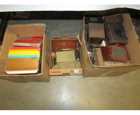 3 boxes containing photographic equipment including parts for old plate camera, brass lenses, black & white negatives, foldin