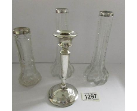 A pair of silver rimmed vases, one other and an a/f silver candlestick.