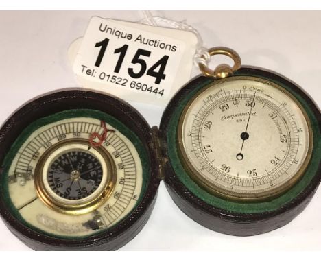 A 19th century cased pocket barometer with compass and ivory scale inside lid (thermometer missing).