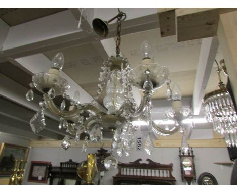 A 5 lamp glass chandelier.