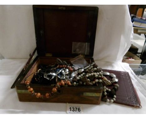 A jewellery box containing a mixed lot of costume jewellery.