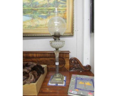 A Victorian silver plated Corinthian column oil lamp.