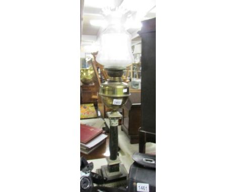 A brass Corinthian column oil lamp with marble column and acid etched shade.