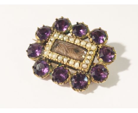 A Georgian amethyst and pearl set brooch in gold.