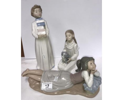 3 NAO figures being boy carrying books, girls petting a puppy and a girl in reclining position.