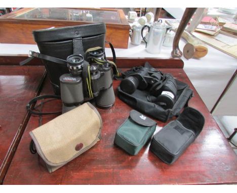 4 pairs of binoculars and a camera.